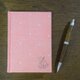 小花の咲く温もりピンクの文庫サイズノートの画像