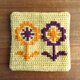 ツヴィスト刺繍のコースター　花　クリームイエローの画像