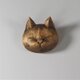 仏師さんの作った猫ブローチの画像
