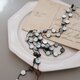 long necklace silk ブラックシェルの画像